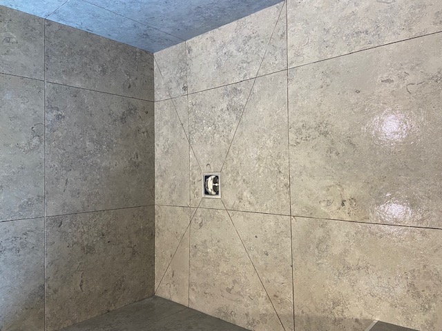 Travertine wet room with linear drain